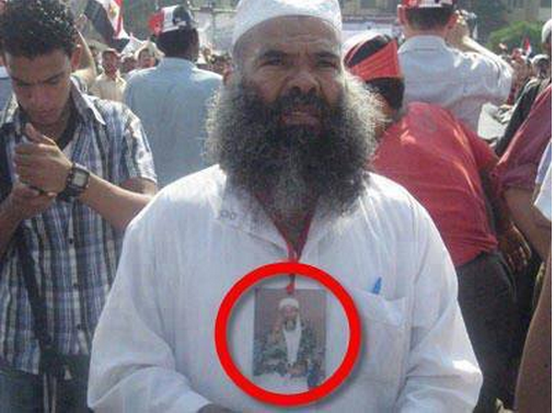 A brotherhood supporter on the 17th of August carrying Bin Laden Picture