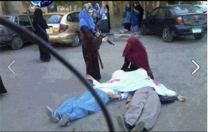 Sisterhood in Egypt faking death scene with fake blood colors that was faked and published by Aljazeera Qatarian Media News