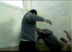 Brotherhood teacher torture a student because he wanted to play a national song while students salute the flag