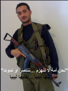 Ahmed Doma political activist carrying a machine gun during the 25Jan 2011 when he declared publically that him and other activists will turn Egypt to another libya